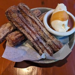 Churros with chili-chocolate ganache, caramel, and whipped cream Churros with chili-chocolate ganache, caramel, and whipped cream