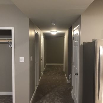 Olde Tyme Craftsmen - a narrow hallway with a stainless steel refrigerator - General Contractors Near Me - Huntingtown, Maryland Olde Tyme Craftsmen - a narrow hallway with a stainless steel refrigerator - General Contractors Near Me - Huntingtown, Maryland
