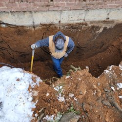 All Cuts Concrete - Murdock in the excavated area for the new windwos