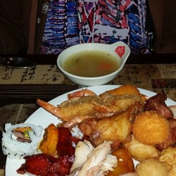Fu Hou Buffet - A chicken? soup, sushi and shrimp on her plate.