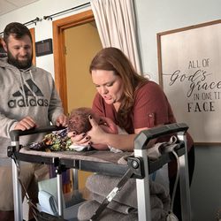 Joyful Beginnings Birth Care - Proud dad watches while midwife Ashley does baby's newborn assessment with care, all in the same room while mama rests