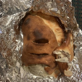 Florio's Pizza - The sausage calzone, very good and cheesy. - Pizza Near Me - San Antonio, Texas Florio's Pizza - The sausage calzone, very good and cheesy. - Pizza Near Me - San Antonio, Texas