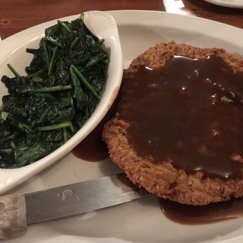 Buffalo Jump Saloon and Steakhouse - Country fried steak with brown gravy and garlic Sauteed Spinach - Steakhouses Near Me - Beulah, Wyoming Buffalo Jump Saloon and Steakhouse - Country fried steak with brown gravy and garlic Sauteed Spinach - Steakhouses Near Me - Beulah, Wyoming