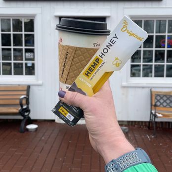 Espresso 59 - a person holding a cup of coffee - Desserts Near Me - Litchfield, Connecticut