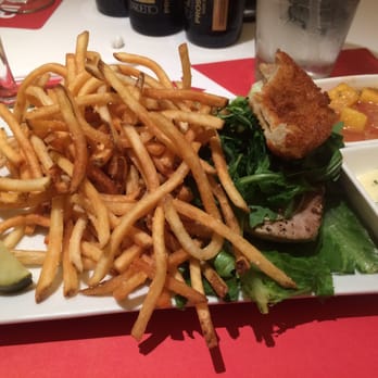 Flip - Tuna burger on a bed of lettuce with mango salsa and tartar sauce on the side - Burgers Near Me - New York, New York Flip - Tuna burger on a bed of lettuce with mango salsa and tartar sauce on the side - Burgers Near Me - New York, New York