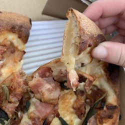 Layer of raw dough in the crust, after being sent back twice