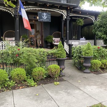 Maison Bleue - Entrance and outdoor seating on the porch to the right. Beautiful architecture! - French Near Me - Cape May, New Jersey Maison Bleue - Entrance and outdoor seating on the porch to the right. Beautiful architecture! - French Near Me - Cape May, New Jersey