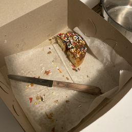 Vanilla cake Chocolate glaze and sprinkles.
