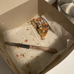 Chelsea Bakery - Vanilla cake Chocolate glaze and sprinkles.