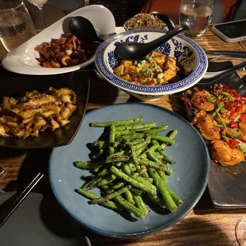 Hutong - String beans, fried noodles (left), kung po chicken (upper left), mapo tofu (upper), Ma La Chilli Prawns (right) - Chinese Near Me - Miami, Florida Hutong - String beans, fried noodles (left), kung po chicken (upper left), mapo tofu (upper), Ma La Chilli Prawns (right) - Chinese Near Me - Miami, Florida