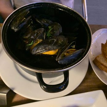 Alison - a bowl of musselling and a plate of french fries - Beer Bar Near Me - New York, New York Alison - a bowl of musselling and a plate of french fries - Beer Bar Near Me - New York, New York