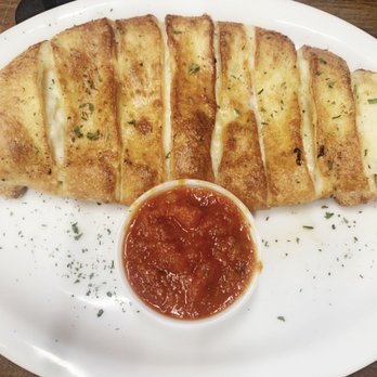 Capone's Pizza - Vegan cheese bread with side of amazing marinara. - Pizza Near Me - Riverside, California Capone's Pizza - Vegan cheese bread with side of amazing marinara. - Pizza Near Me - Riverside, California
