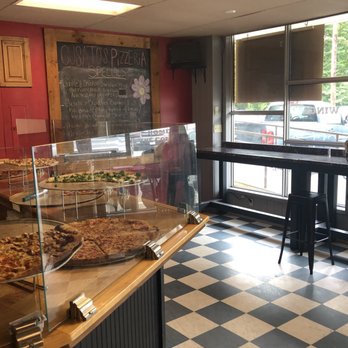 Cusato's Pizzeria and Deli - a woman sitting at the counter - Pizza Near Me - Ballston Spa, New York