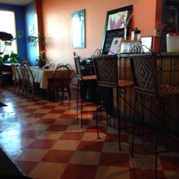 a view of a restaurant with a checkered floor a view of a restaurant with a checkered floor