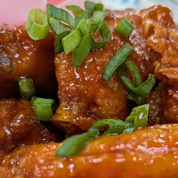 Love Supreme Pizza Bar - Close up of the Wings with ATX Honey Sambal Sauce - Pizza Near Me - Austin, Texas Love Supreme Pizza Bar - Close up of the Wings with ATX Honey Sambal Sauce - Pizza Near Me - Austin, Texas