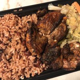 Jerk chicken with rice & peas & veggies to go. Yum Jerk chicken with rice & peas & veggies to go. Yum