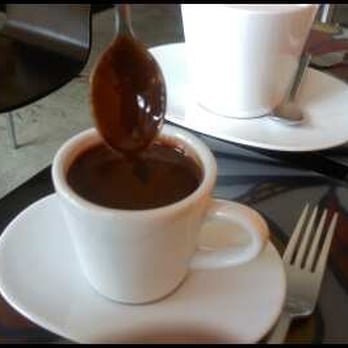 Kafe K - The hot chocolate (concentrated version) served in a small cup, see how it sticks to the spoon like syrup? LOVELY - Breakfast & Brunch Near Me - Santa Monica, California Kafe K - The hot chocolate (concentrated version) served in a small cup, see how it sticks to the spoon like syrup? LOVELY - Breakfast & Brunch Near Me - Santa Monica, California
