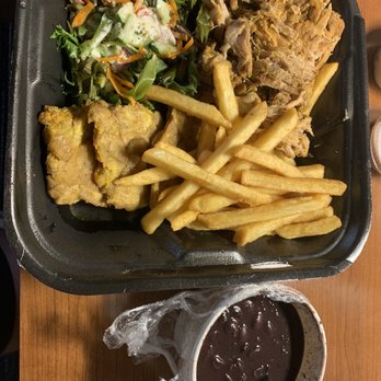 Sofrito Latin Cafe - Pork with fries, salad, black beans and Tostones - Latin American Near Me - Orlando, Florida Sofrito Latin Cafe - Pork with fries, salad, black beans and Tostones - Latin American Near Me - Orlando, Florida