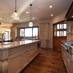 Custom cabinetry, and just the right lighting create a well appointed kitchen.