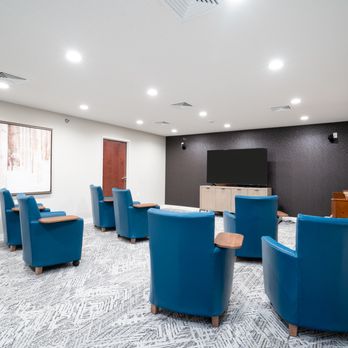 Vista Prairie at Copperleaf - A clean, spacious media or classroom setting. Teal blue leather armchairs with built-in wooden tablet arms are arranged in ro... - Community Service/Non-Profit Near Me - Willmar, Minnesota Vista Prairie at Copperleaf - A clean, spacious media or classroom setting. Teal blue leather armchairs with built-in wooden tablet arms are arranged in ro... - Community Service/Non-Profit Near Me - Willmar, Minnesota