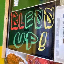 Bless Up Jamaican Restaurant - Lobby sign