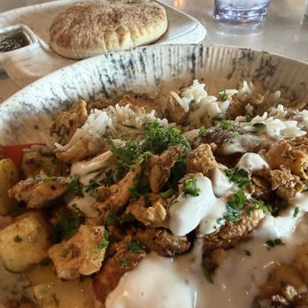 Meddys - Background: Pita  Foreground Big Bowl 1/2 rice 1/2 veg with Shawarma chicken - Mediterranean Near Me - Lenexa, Kansas