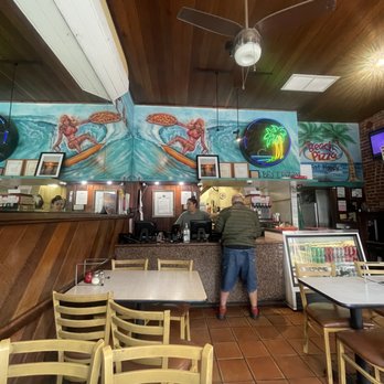 Beach pizza - a man standing in a restaurant - Pizza Near Me - Manhattan Beach, California Beach pizza - a man standing in a restaurant - Pizza Near Me - Manhattan Beach, California