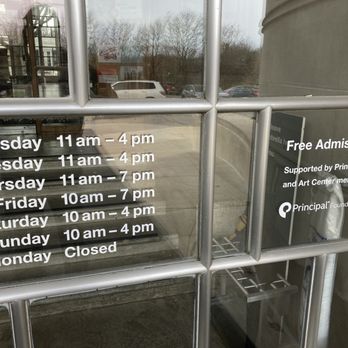 Des Moines Art Center - hours of operation posted next to front entrance - Museums Near Me - Des Moines, Iowa