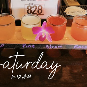 The 828 - Mimosa flight & company at the bar EXCELLENT.   Do yourself a favor, look through the port hole!!!! - Beer Bar Near Me - Lake Lure, North Carolina