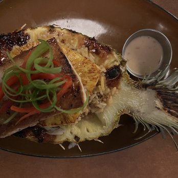 Common Restaurant  - Pineapple Situation: Stuffed pineapple with pork fried rice & topped with Korean BBQ glazed Mahi-Mahi - Cocktail Bars Near Me - Savannah, Georgia