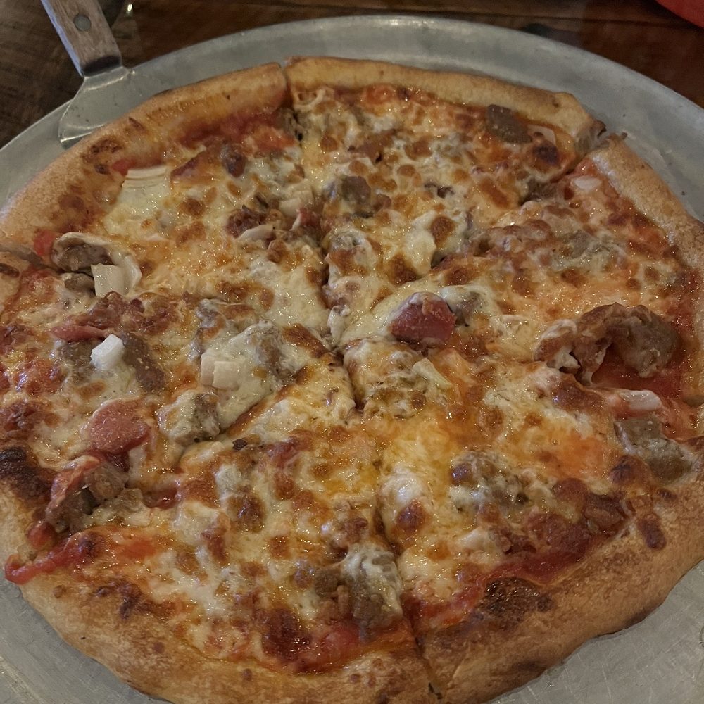Flatwoods Cafe - Meat lovers pizza minus pepperoni add onions. So good from the woodfired oven. - Italian Near Me - Lamont, Florida Flatwoods Cafe - Meat lovers pizza minus pepperoni add onions. So good from the woodfired oven. - Italian Near Me - Lamont, Florida