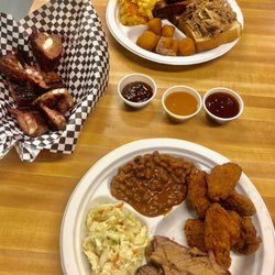 Bump & Grind featuring Bruh-Bruh's BBQ - Rib tips appetizer and two combos - beef brisket and chicken wings (with coleslaw and baked bean sides) and ribs and pulled pork.