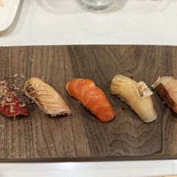 5 piece nigiri from the set menu with truffle shavings added 5 piece nigiri from the set menu with truffle shavings added
