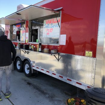 Honeymoon Bay Coffee Roasters - a man standing in front of a food truck - Coffee Roasteries Near Me - Clinton, Washington Honeymoon Bay Coffee Roasters - a man standing in front of a food truck - Coffee Roasteries Near Me - Clinton, Washington
