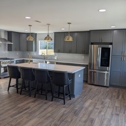 a kitchen with a center island a kitchen with a center island