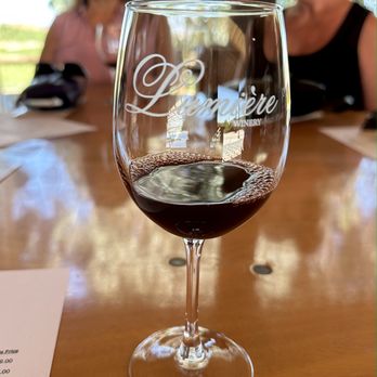 Lumiere Winery - a glass of wine on a table - Wineries Near Me - Temecula, California Lumiere Winery - a glass of wine on a table - Wineries Near Me - Temecula, California