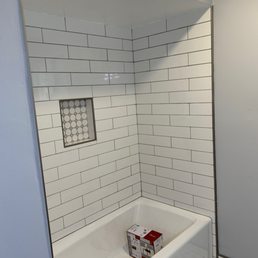 New cast iron bathtub and tile surround. New cast iron bathtub and tile surround.