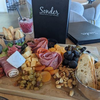 Sonder - The full Charcuterie board. It's so big we took some home. - American Near Me - Bakersfield, California Sonder - The full Charcuterie board. It's so big we took some home. - American Near Me - Bakersfield, California