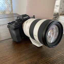 Berger Bros Camera Video Digital - Sony A7IV Mirrorless Camera with a Sony FE 70-200mm lens.