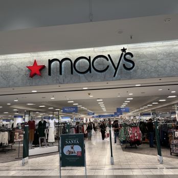 Macy's - Interior view of Macy's in Albuquerque, NM, showing clothing sections for kids and toys, with shoppers browsing. - Department Stores Near Me - Albuquerque, New Mexico