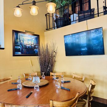 Scusi! - a dining room with a flat screen tv - Italian Near Me - Pullman, Washington Scusi! - a dining room with a flat screen tv - Italian Near Me - Pullman, Washington