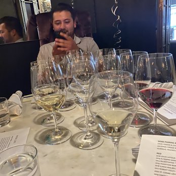 The Saint - Here's my son in front of the wine glasses from our tasting. - New American Near Me - Saint Helena, California