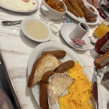 Junior's - The spread isn't sparse; bring your appetite. Here we have French toast and a simple two-egg breakfast with all the sides. - Breakfast & Brunch Near Me - Las Vegas, Nevada Junior's - The spread isn't sparse; bring your appetite. Here we have French toast and a simple two-egg breakfast with all the sides. - Breakfast & Brunch Near Me - Las Vegas, Nevada