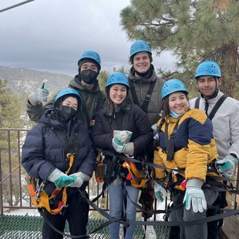 Action Tours - Friendly guides taking a picture of our group during the ziplining course! - Tours Near Me - Big Bear Lake, California Action Tours - Friendly guides taking a picture of our group during the ziplining course! - Tours Near Me - Big Bear Lake, California