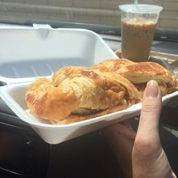 a person holding a tray of food
