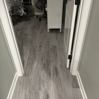 Deckers Remodeling - Hall and bedroom floor crack traveled towards - General Contractors Near Me