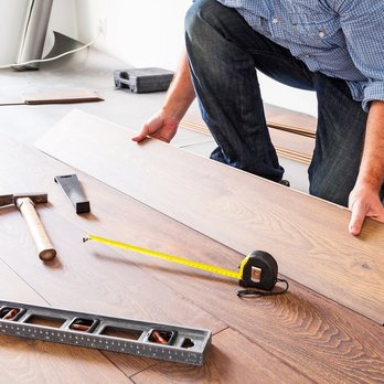 Cordova's Custom Flooring - a man working on a hardwood floor - Flooring Near Me Cordova's Custom Flooring - a man working on a hardwood floor - Flooring Near Me