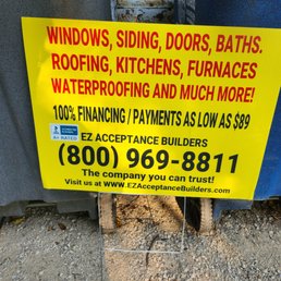 a sign that says windows, siding, doors, baths, roofing, kitchens, furnaces, waterproof