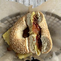Bagel Island Sandwich Shoppe - Sesame bagel with bacon and egg