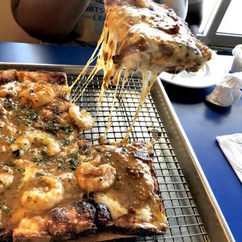 Reginelli's Pizzeria - Bbq shrimp pizza! Look at the cheese pull. - Pizza Near Me - Baton Rouge, Louisiana